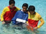 RESCUES, INITIATIVE TEST, 3
Filipino rescuers assist an injured swimmer onto the beach 4